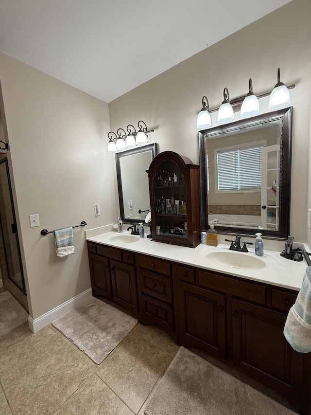 bathroom featuring vanity, a bathing tub, and tile patterned floors