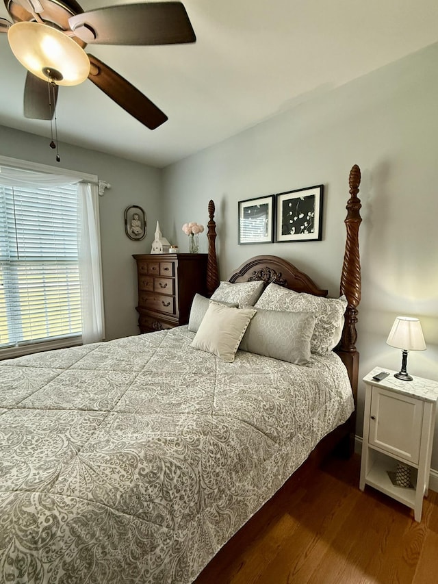 bedroom with hardwood / wood-style flooring and ceiling fan