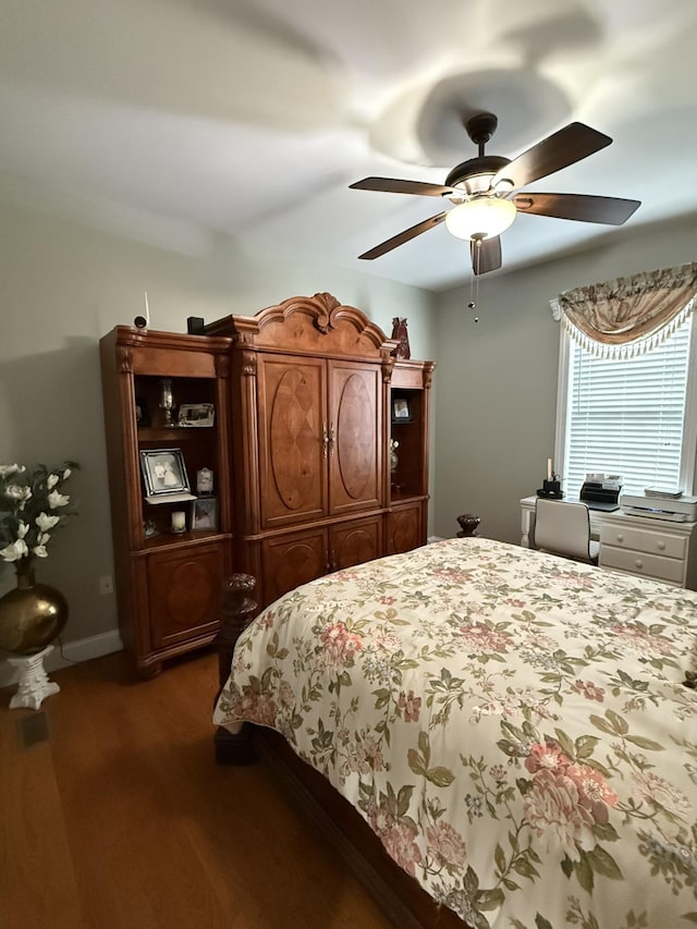 bedroom featuring dark hardwood / wood-style floors and ceiling fan