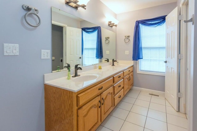 bathroom featuring tile patterned flooring and vanity