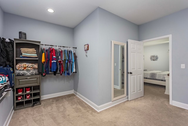 walk in closet featuring carpet