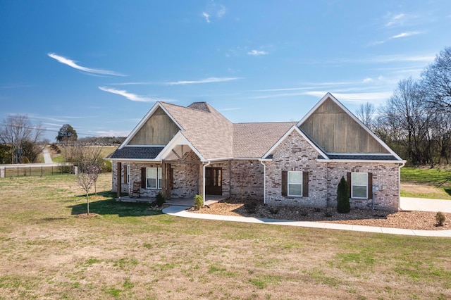 craftsman-style house with a front yard