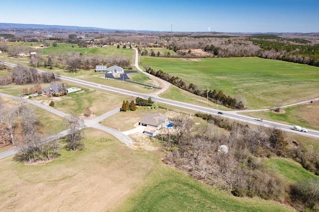 birds eye view of property with a rural view