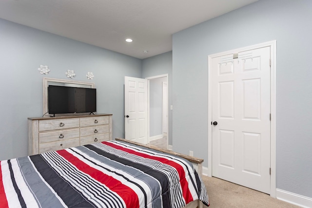 bedroom with light colored carpet