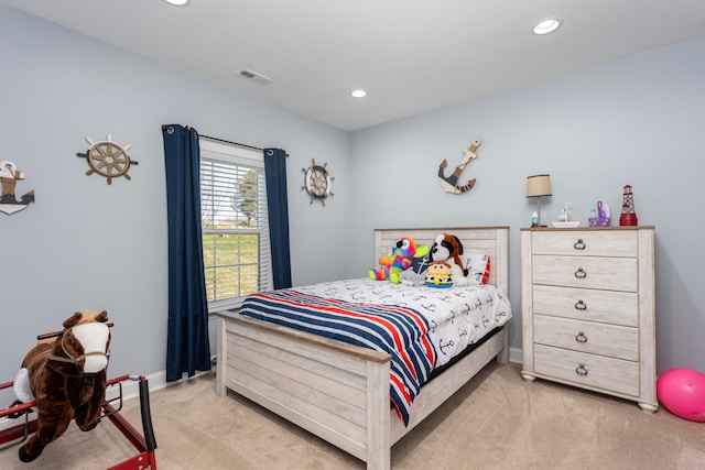 bedroom with light carpet