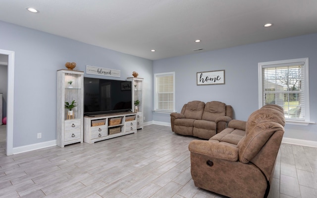 living room with light hardwood / wood-style floors