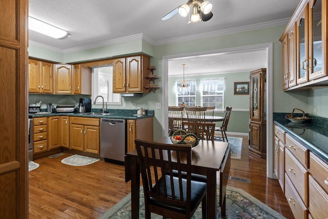 kitchen featuring dark wood-type flooring, brown cabinetry, a sink, and stainless steel dishwasher