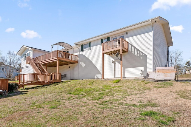 back of house with a deck, a yard, and stairs