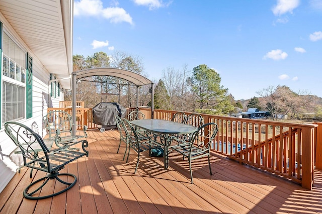 wooden deck with outdoor dining area