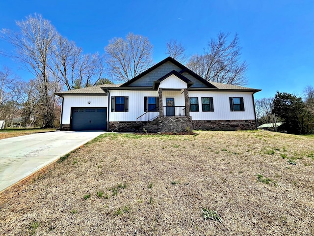 view of front of house with crawl space, concrete driveway, and an attached garage