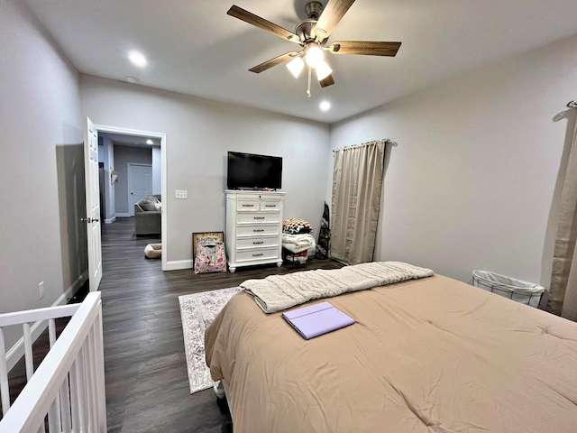 bedroom with dark wood finished floors, recessed lighting, baseboards, and ceiling fan