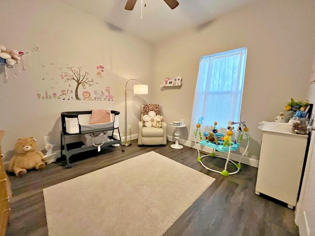 game room with baseboards, ceiling fan, and wood finished floors