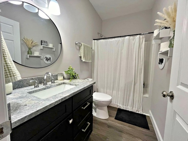 bathroom with vanity, wood finished floors, baseboards, toilet, and shower / tub combo with curtain