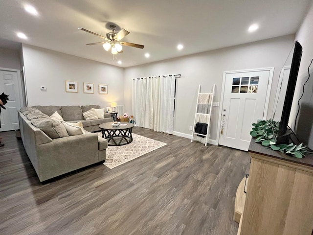 living room featuring recessed lighting, baseboards, ceiling fan, and dark wood finished floors