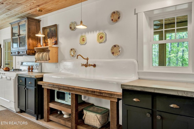 355 Cross Keys Ln, Ten Mile, TN 37880 - kitchen with white range, light countertops, glass insert cabinets, hanging light fixtures, and wood ceiling