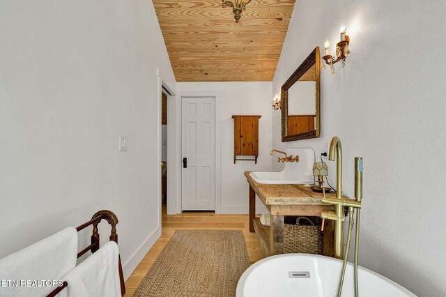 355 Cross Keys Ln, Ten Mile, TN 37880 - full bathroom with wood ceiling, a freestanding bath, vaulted ceiling, wood finished floors, and baseboards