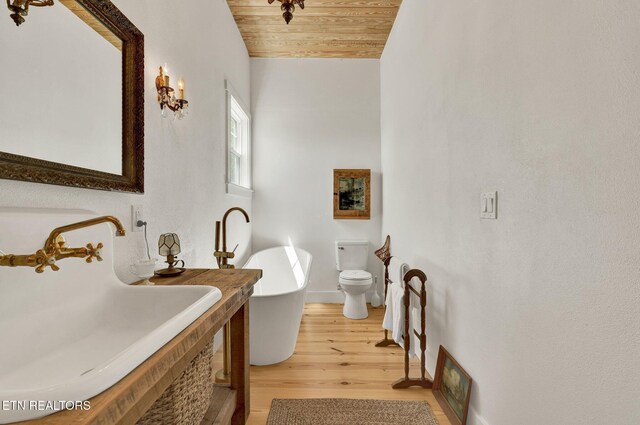 355 Cross Keys Ln, Ten Mile, TN 37880 - full bathroom with a sink, wood finished floors, wooden ceiling, a soaking tub, and baseboards
