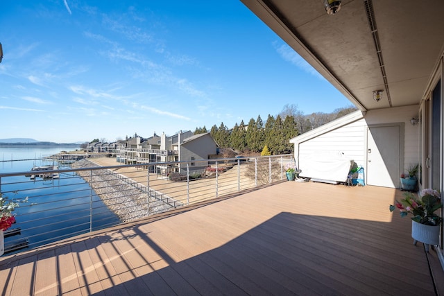 wooden deck featuring a water view