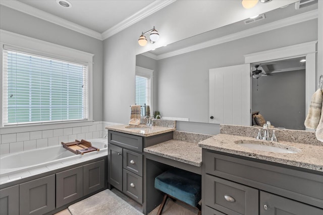 bathroom featuring crown molding, a tub to relax in, vanity, and ceiling fan