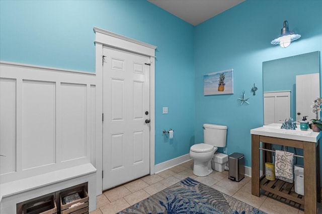 bathroom featuring tile patterned flooring and toilet