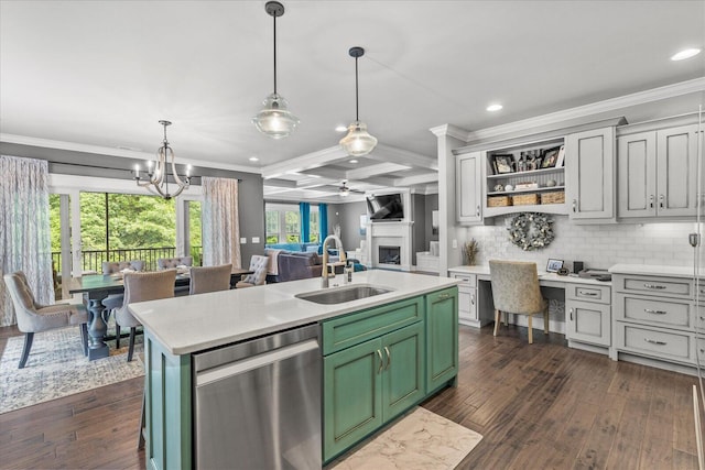 kitchen with coffered ceiling, sink, dishwasher, an island with sink, and beamed ceiling