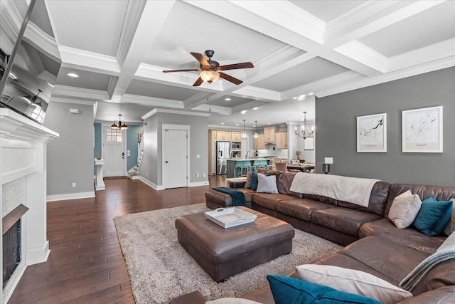 living room with coffered ceiling, ornamental molding, beam ceiling, and dark wood-type flooring