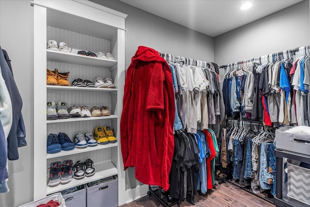 spacious closet featuring hardwood / wood-style flooring