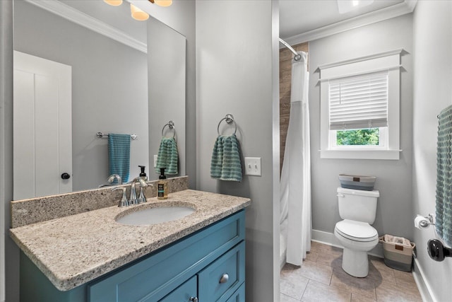 bathroom featuring tile patterned flooring, ornamental molding, vanity, and toilet