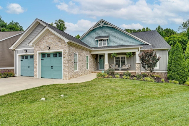 craftsman-style house with a garage, a front yard, and a porch