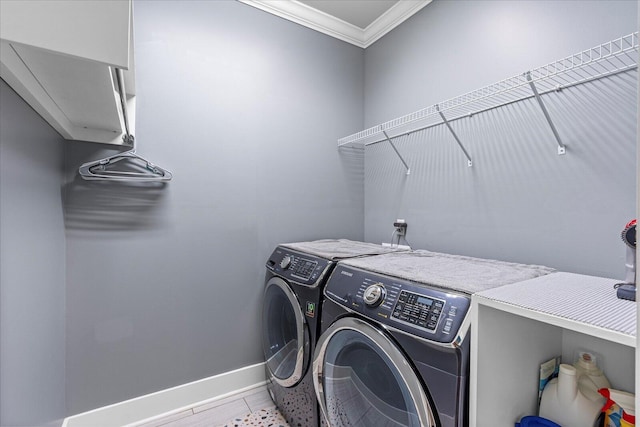 clothes washing area with crown molding and independent washer and dryer