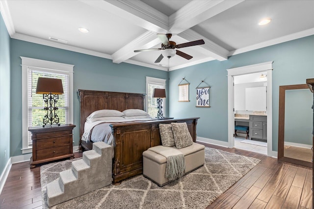 bedroom featuring ornamental molding, ensuite bathroom, and ceiling fan