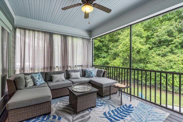 sunroom featuring ceiling fan