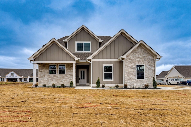 craftsman-style house with a front lawn