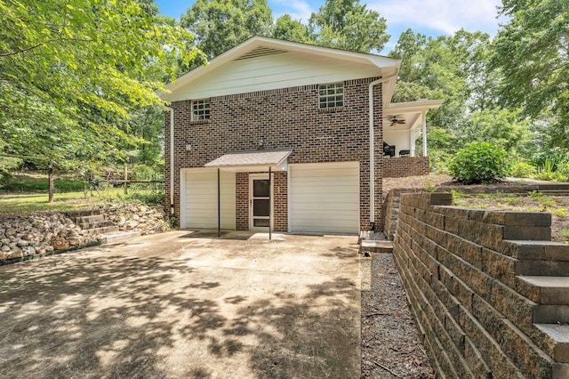 547 Van Davis Rd NW, Georgetown, TN 37336 - back of house featuring brick siding, an attached garage, and concrete driveway