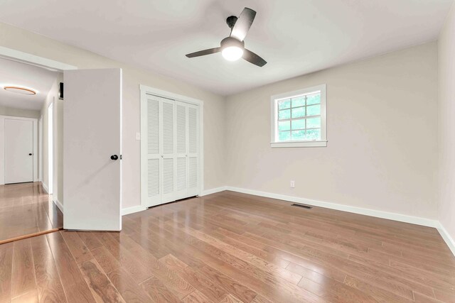 547 Van Davis Rd NW, Georgetown, TN 37336 - unfurnished bedroom featuring wood finished floors, a closet, and ceiling fan