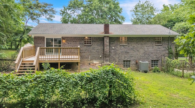 547 Van Davis Rd NW, Georgetown, TN 37336 - rear view of property with a deck, brick siding, a yard, a chimney, and roof with shingles