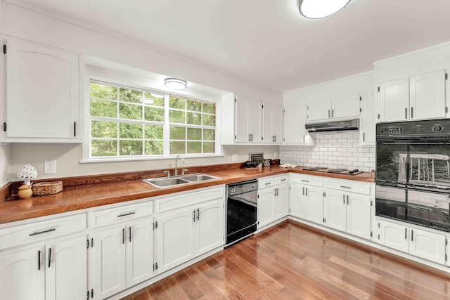 547 Van Davis Rd NW, Georgetown, TN 37336 - kitchen featuring black appliances, white cabinets, light wood-style flooring, and decorative backsplash