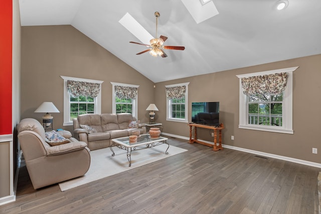 681 Pinhook Rd, Calhoun, TN 37309 - living area with a skylight, ceiling fan, wood finished floors, high vaulted ceiling, and baseboards