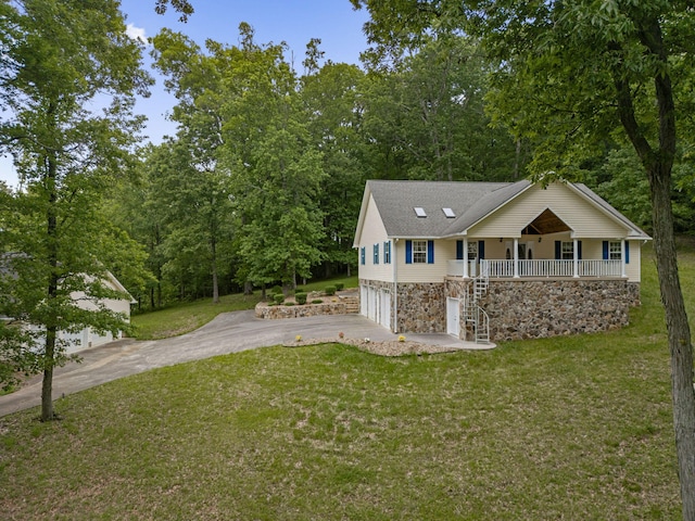 681 Pinhook Rd, Calhoun, TN 37309 - view of front of property with asphalt driveway, stone siding, a garage, a porch, and a front lawn