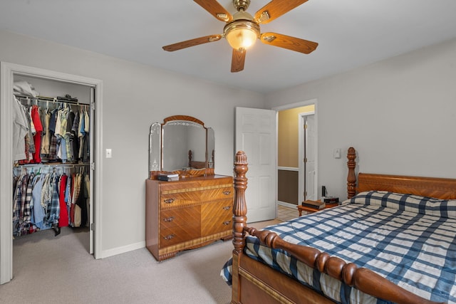 681 Pinhook Rd, Calhoun, TN 37309 - bedroom featuring a closet, baseboards, a walk in closet, light carpet, and ceiling fan