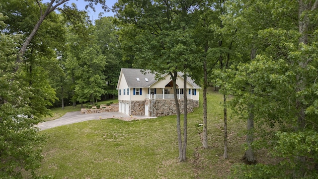 681 Pinhook Rd, Calhoun, TN 37309 - view of front of property featuring driveway, an attached garage, a front lawn, covered porch, and stone siding