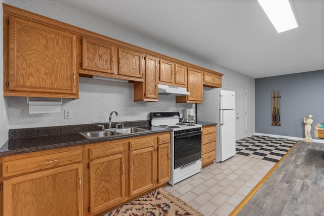 681 Pinhook Rd, Calhoun, TN 37309 - kitchen with white appliances, under cabinet range hood, a sink, dark countertops, and baseboards