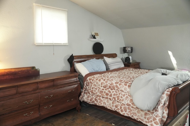 bedroom with lofted ceiling