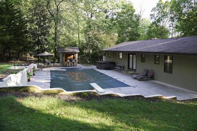 view of pool with a patio, a hot tub, a diving board, a yard, and an outdoor bar