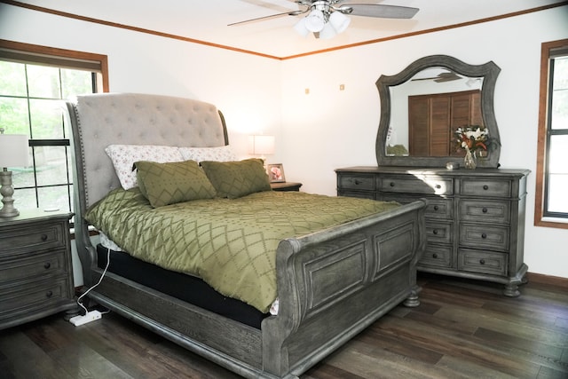 bedroom featuring crown molding, ceiling fan, and dark wood-type flooring