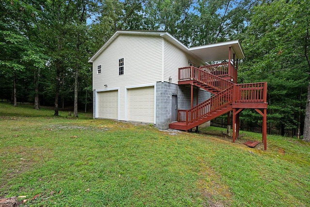 865 Ewing Rd, Spring City, TN 37381 - view of home's exterior featuring a garage, stairs, a lawn, and a wooden deck