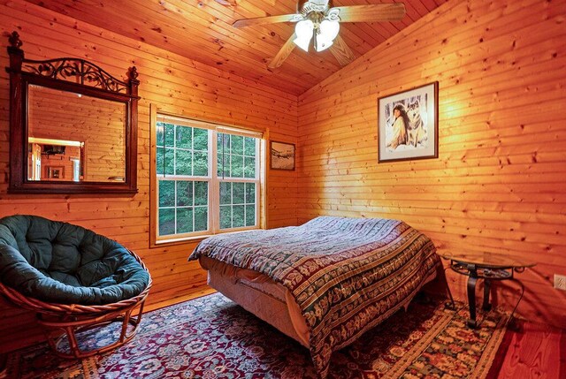 865 Ewing Rd, Spring City, TN 37381 - bedroom with lofted ceiling, wood-type flooring, wood ceiling, wooden walls, and ceiling fan