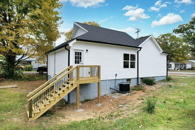 rear view of house with central AC