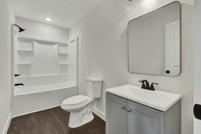 full bathroom featuring wood-type flooring, vanity, toilet, and shower / washtub combination