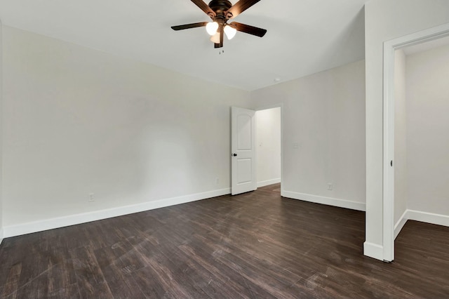 interior space with ceiling fan and dark hardwood / wood-style floors